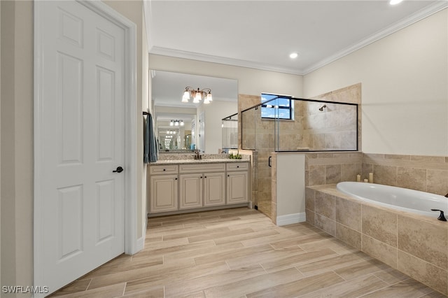 bathroom with vanity, wood finish floors, a shower stall, crown molding, and a bath