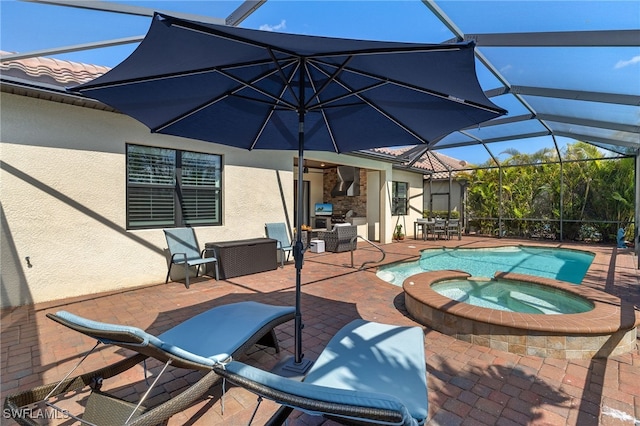 view of swimming pool with glass enclosure, a pool with connected hot tub, and a patio area