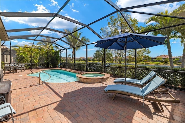 view of swimming pool featuring glass enclosure, a pool with connected hot tub, and a patio area