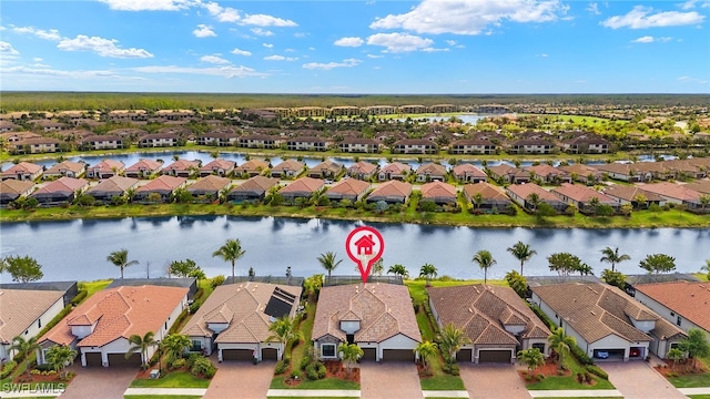 aerial view with a residential view and a water view