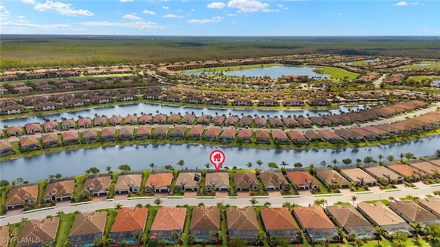 bird's eye view with a residential view and a water view