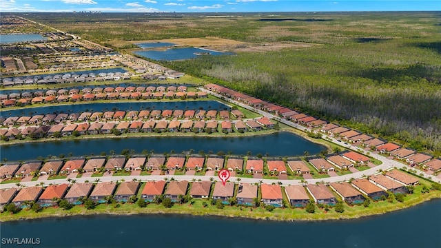 birds eye view of property with a residential view and a water view