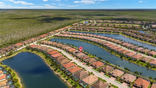 birds eye view of property featuring a residential view and a water view