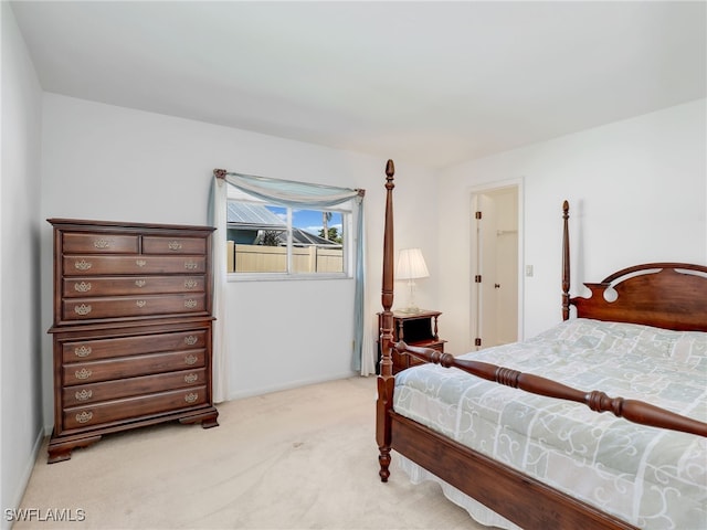 bedroom featuring light colored carpet