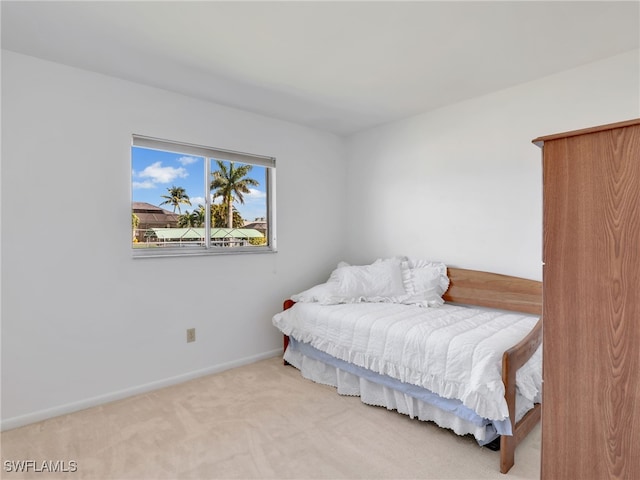 carpeted bedroom with baseboards