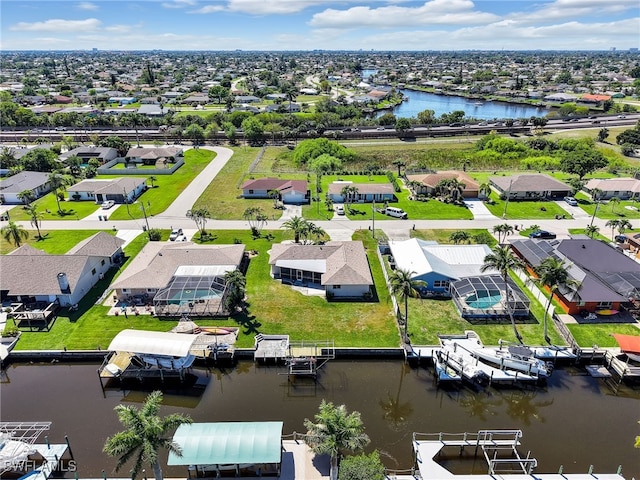 bird's eye view featuring a residential view and a water view