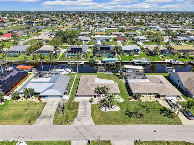 aerial view with a residential view and a water view