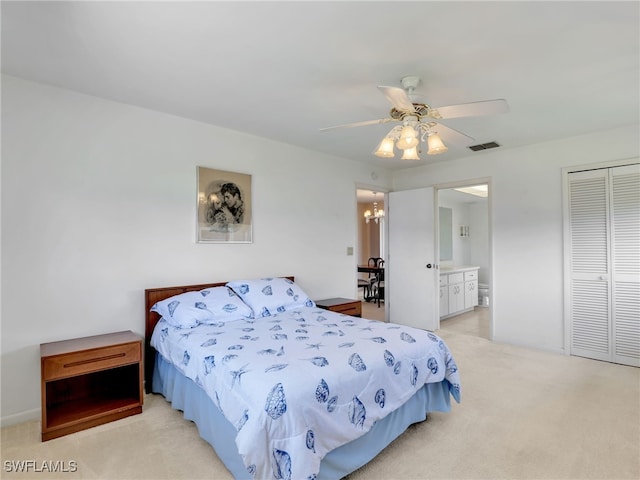 bedroom with visible vents, a closet, baseboards, light colored carpet, and ceiling fan