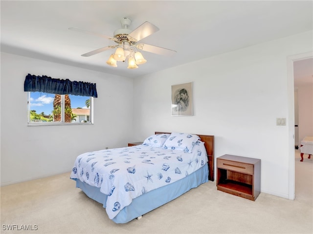 carpeted bedroom with a ceiling fan