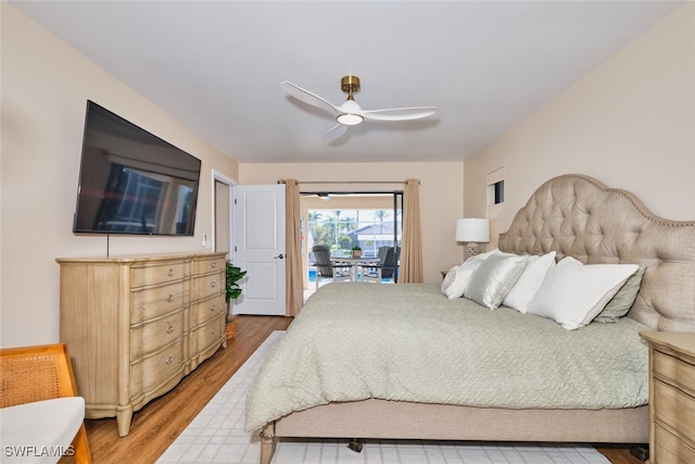 bedroom with light wood-type flooring, ceiling fan, and access to outside