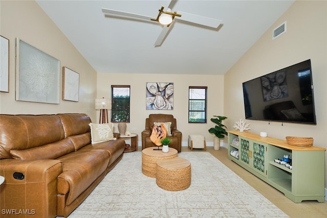 living room with vaulted ceiling, baseboards, visible vents, and ceiling fan