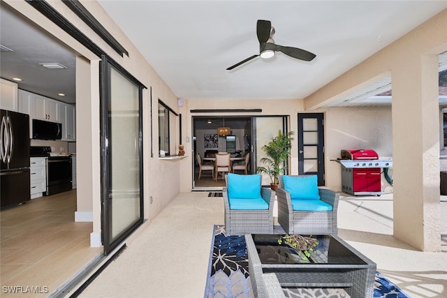 view of patio / terrace with a grill and ceiling fan