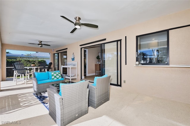 view of patio featuring an outdoor living space, ceiling fan, and outdoor dining space