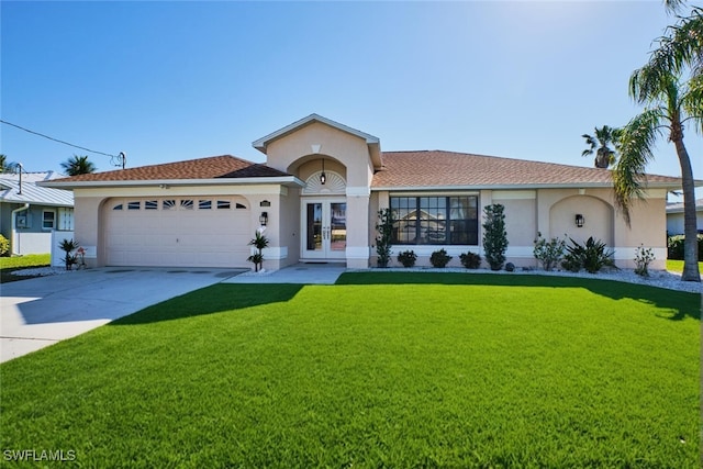 view of front facade featuring french doors, a garage, a front lawn, and stucco siding