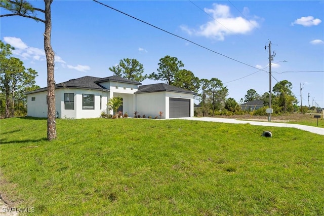 prairie-style house with a front lawn, an attached garage, driveway, and stucco siding