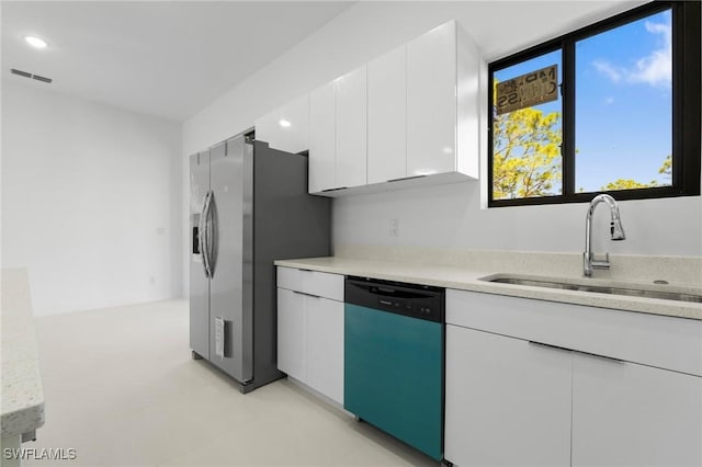 kitchen featuring a sink, dishwasher, stainless steel fridge with ice dispenser, and light countertops