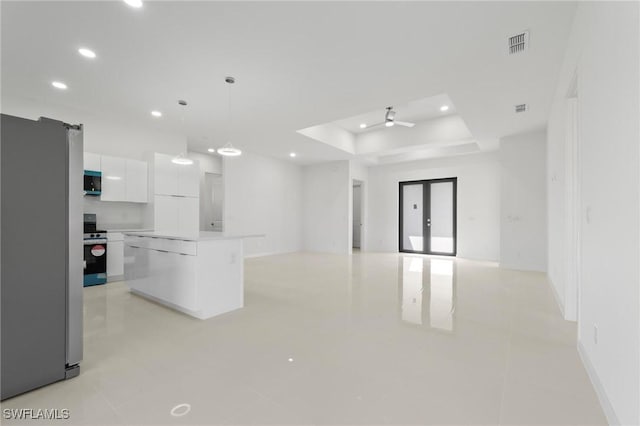 kitchen featuring a center island, recessed lighting, appliances with stainless steel finishes, white cabinets, and modern cabinets