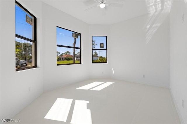 empty room with plenty of natural light and ceiling fan