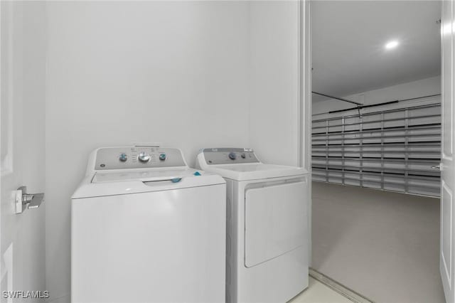 laundry area with laundry area and separate washer and dryer