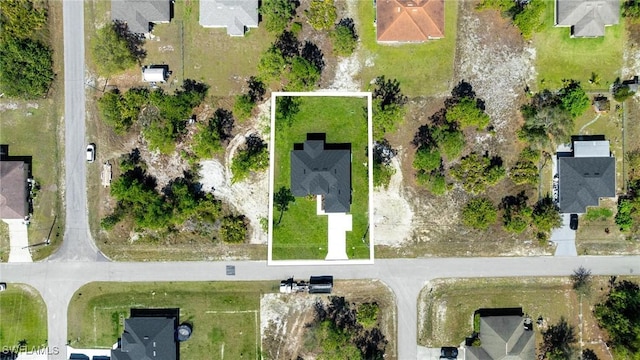 birds eye view of property with a residential view