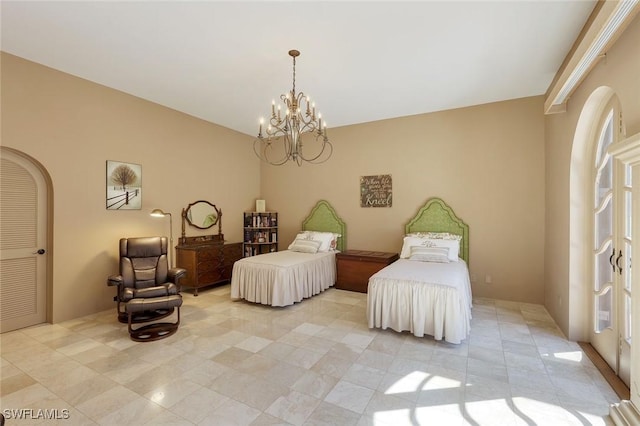 bedroom with a notable chandelier