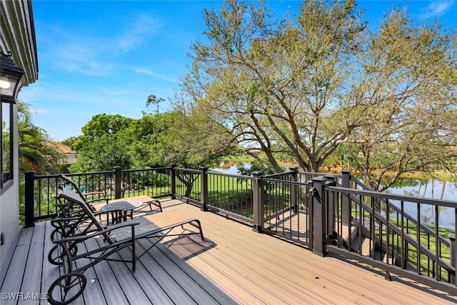 deck featuring a water view