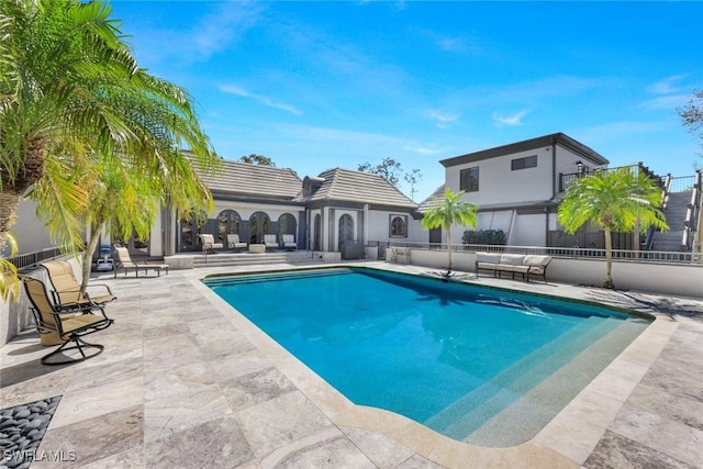 pool with a patio area