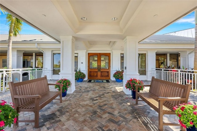 view of patio / terrace with covered porch and french doors