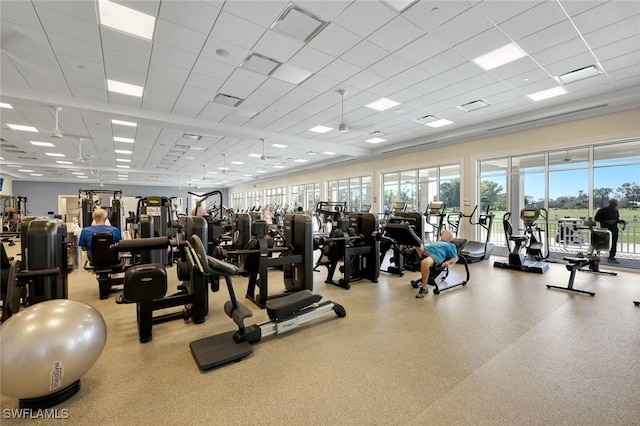 exercise room featuring visible vents and a drop ceiling