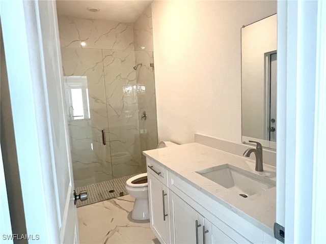 full bathroom with a marble finish shower, marble finish floor, toilet, and vanity