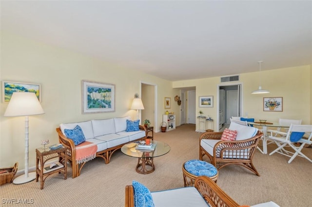 living room with visible vents and carpet