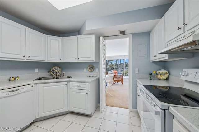 kitchen with white appliances, visible vents, a sink, light countertops, and white cabinetry