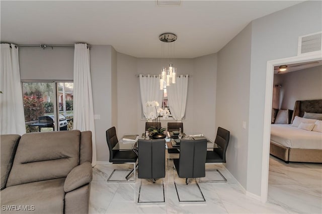 dining area with visible vents, baseboards, marble finish floor, and an inviting chandelier