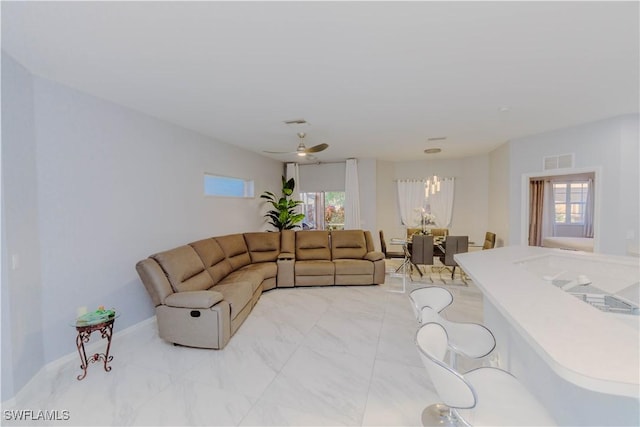 living room with visible vents, marble finish floor, and a healthy amount of sunlight