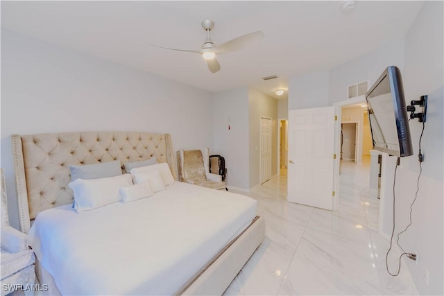 bedroom with a closet, visible vents, marble finish floor, and ceiling fan