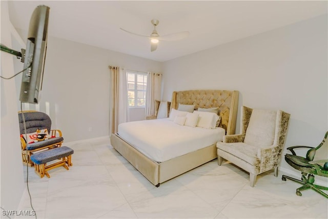 bedroom featuring baseboards, marble finish floor, and ceiling fan