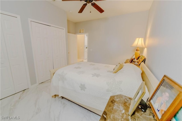 bedroom with marble finish floor and ceiling fan