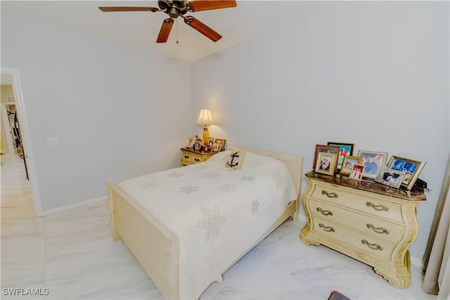 bedroom with marble finish floor, baseboards, and ceiling fan