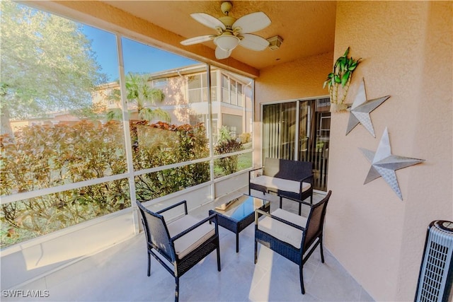 sunroom / solarium with ceiling fan