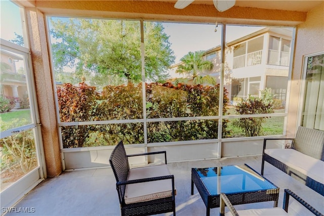 sunroom / solarium featuring a wealth of natural light and ceiling fan