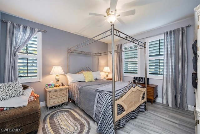 bedroom featuring a ceiling fan and baseboards