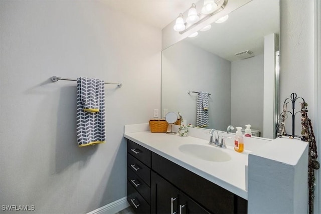 bathroom featuring vanity and visible vents