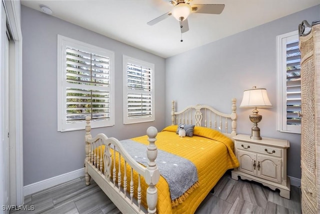 bedroom featuring baseboards and a ceiling fan