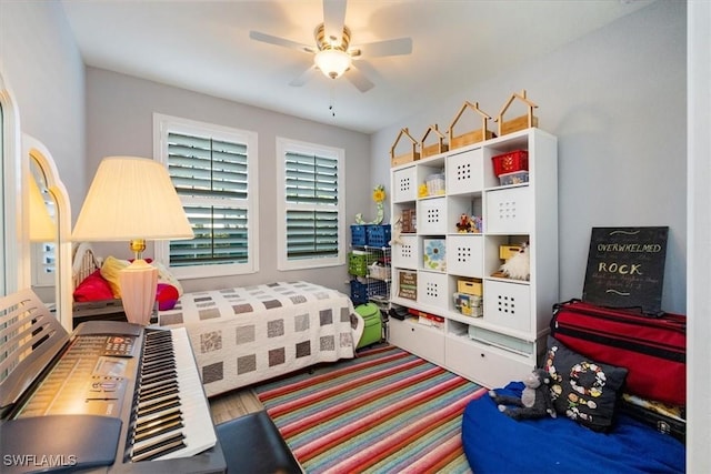 playroom with carpet floors and ceiling fan