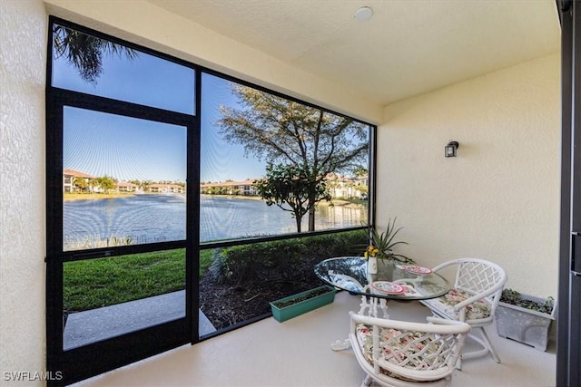 sunroom with a water view