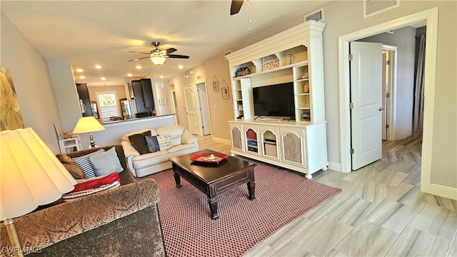 living room with visible vents, recessed lighting, baseboards, and ceiling fan