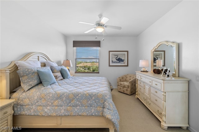 bedroom featuring ceiling fan and light carpet