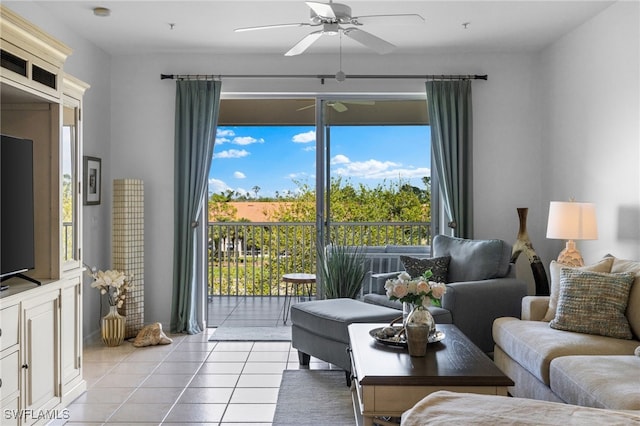 living area with light tile patterned flooring and a ceiling fan