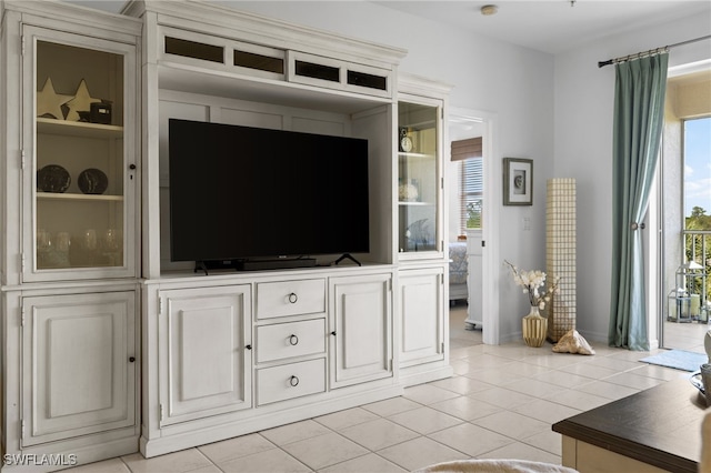 living area with light tile patterned floors