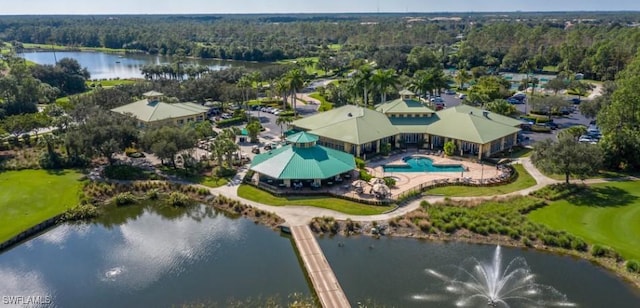 birds eye view of property with a water view